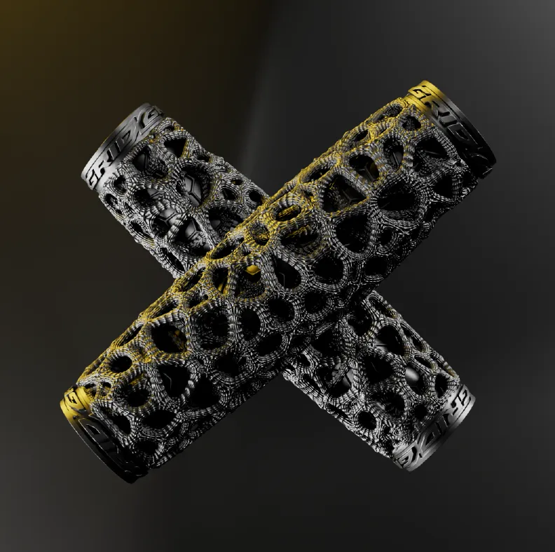 A pair of ExoGrips crossed in an X, the open web lattice catching gold light against a dark background