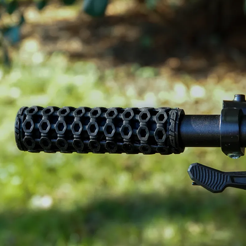 A HexGrip fitted to a mountain bike handlebar outdoors, with grass behind